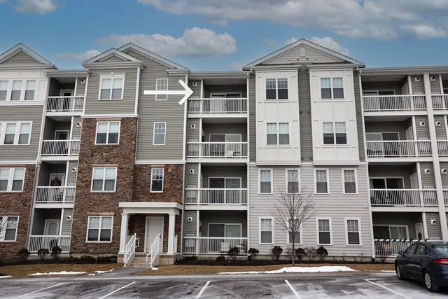 a front view of a building with lot of windows