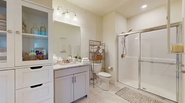 a bathroom with a sink toilet and shower