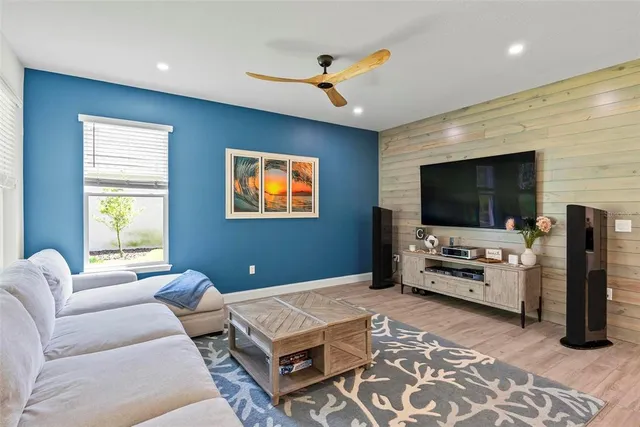 a bedroom with furniture and a flat screen tv