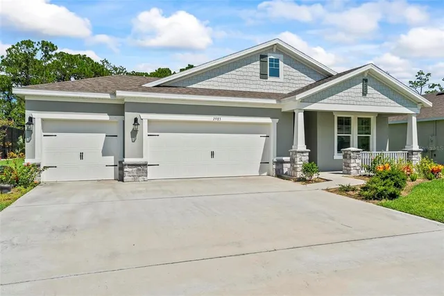 a large kitchen with stainless steel appliances kitchen island granite countertop a large island in the center