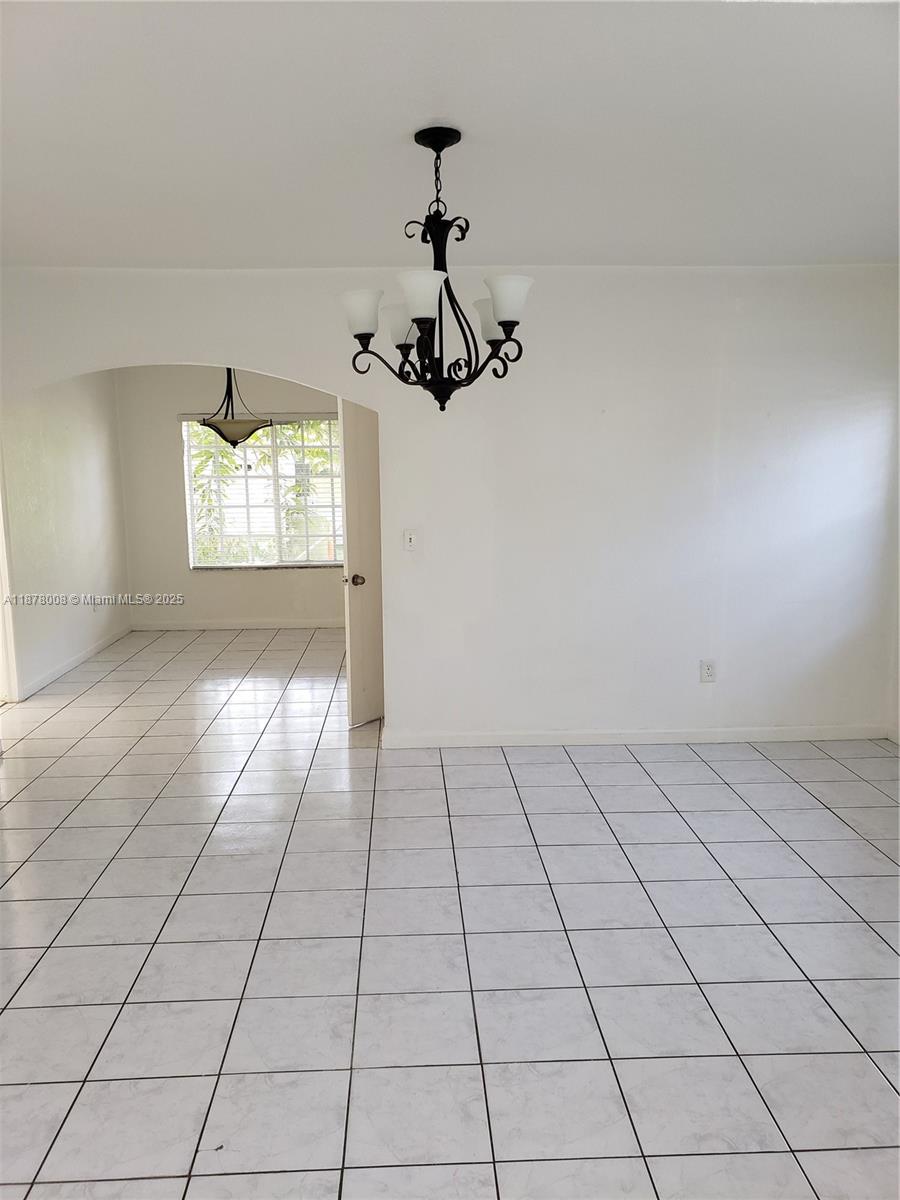 6912 Northeast 5th Avenue, Unit 2 Miami, FL 33138 - Photo 12 of 18 a view of an empty room and window