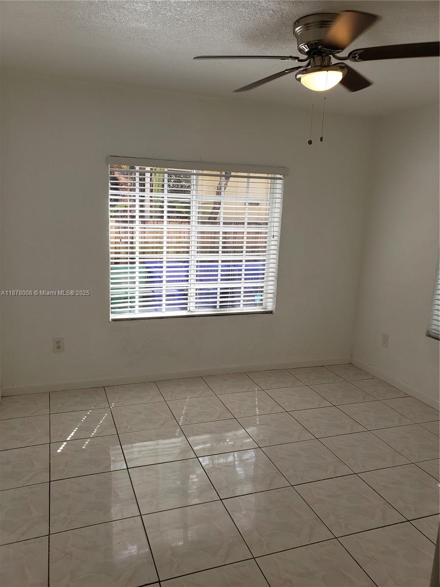 6912 Northeast 5th Avenue, Unit 2 Miami, FL 33138 - Photo 14 of 18 a view of an empty room with a window
