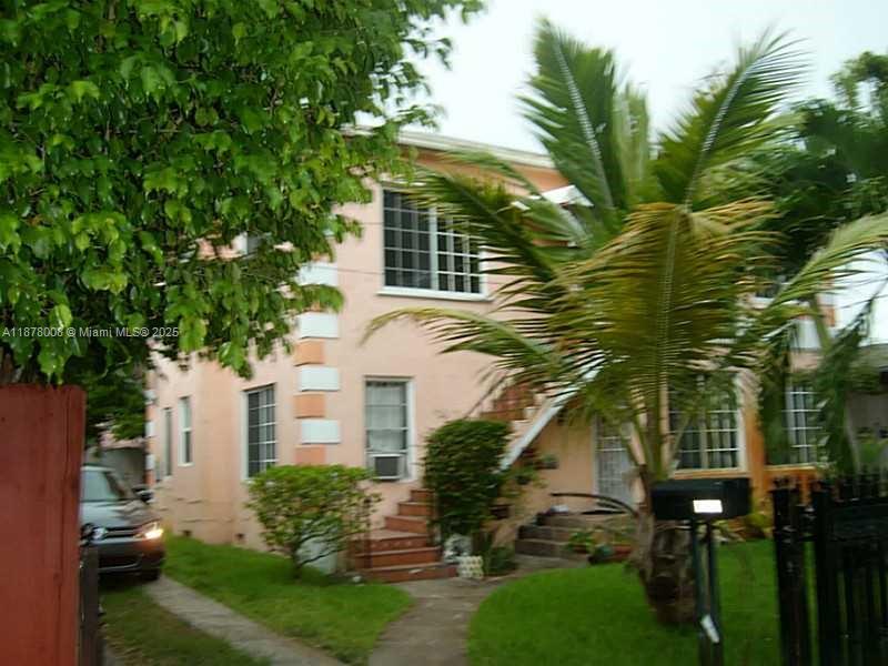 6912 Northeast 5th Avenue, Unit 2 Miami, FL 33138 - Photo 2 of 18 a view of a house with a yard