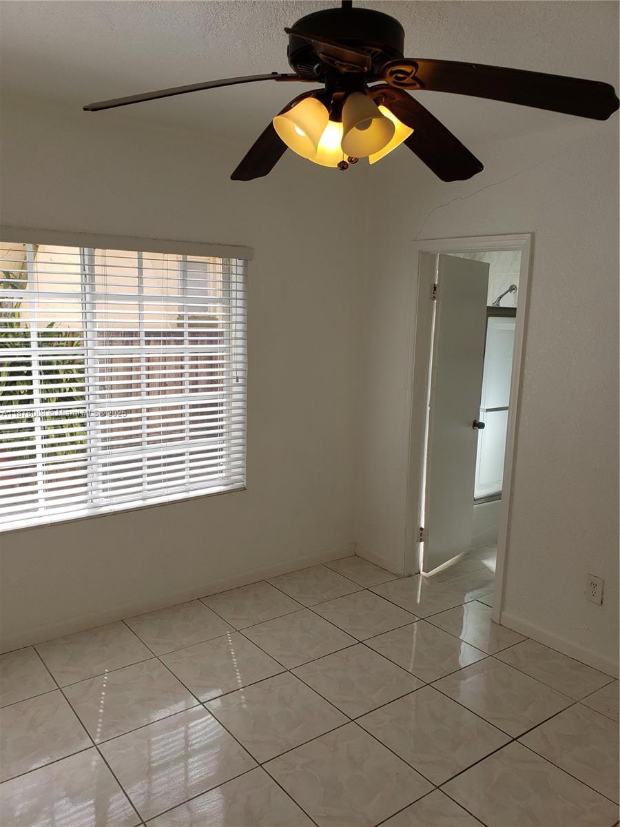 6912 Northeast 5th Avenue, Unit 2 Miami, FL 33138 - Photo 8 of 18 a view of an empty room with a window