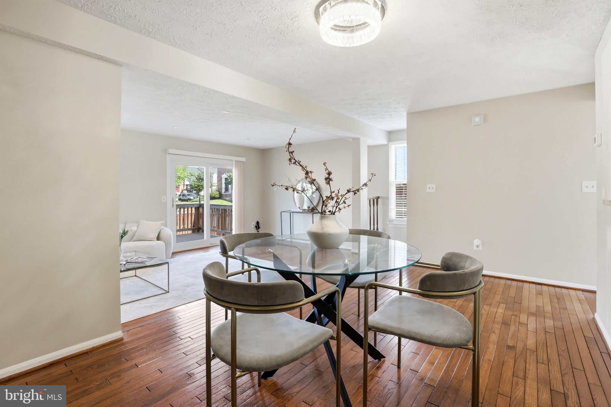 6167 Morning Glory Road Alexandria, VA 22310 - Photo 11 of 39 a view of a dining room with furniture and wooden floor