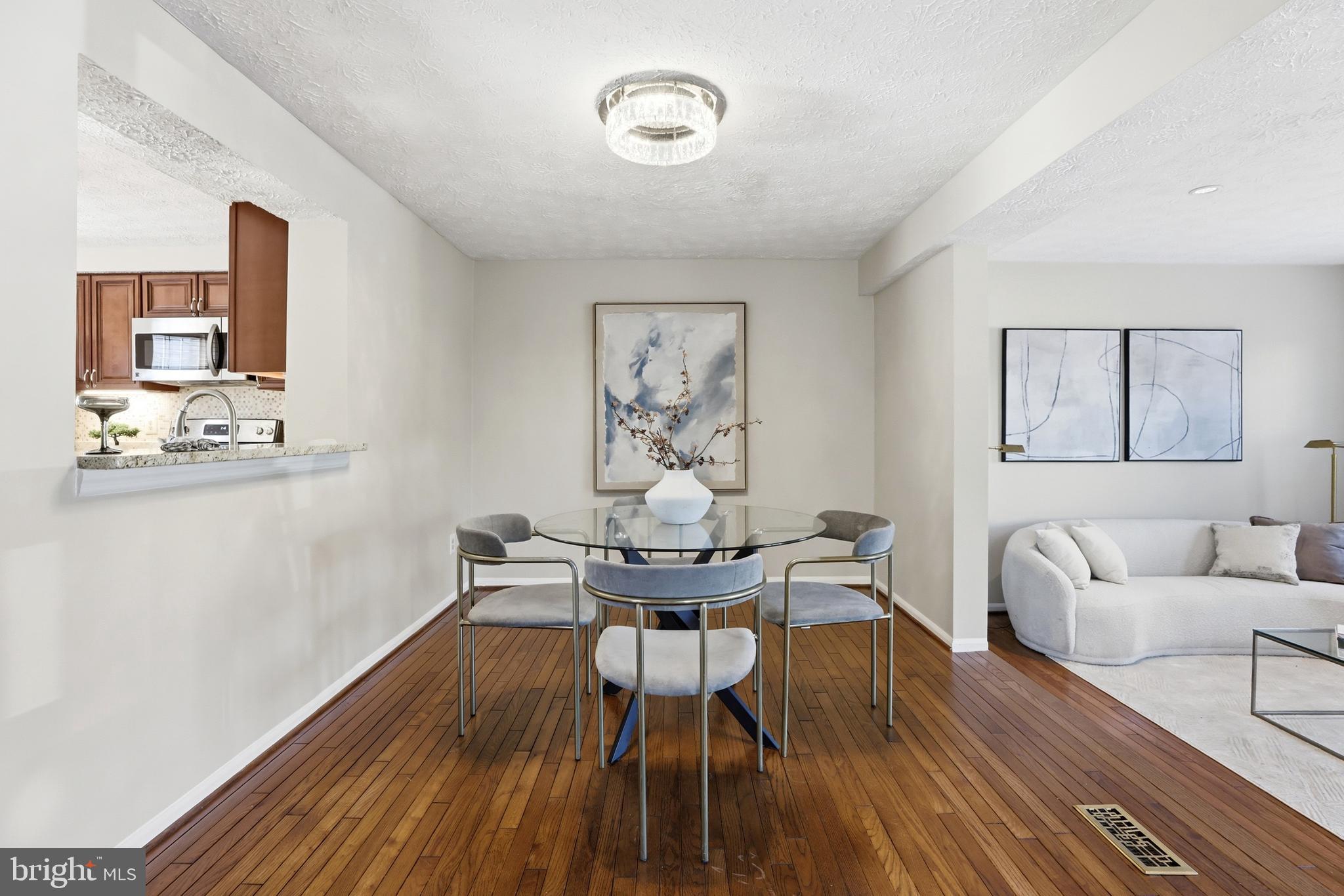 6167 Morning Glory Road Alexandria, VA 22310 - Photo 12 of 39 a view of a dining room with furniture and wooden floor