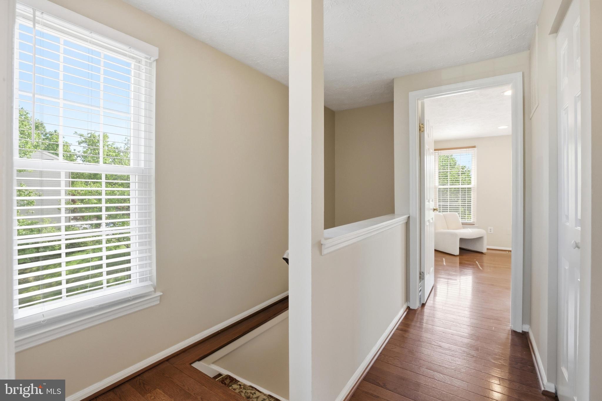 6167 Morning Glory Road Alexandria, VA 22310 - Photo 18 of 39 a view of a hallway with wooden floor and a living room