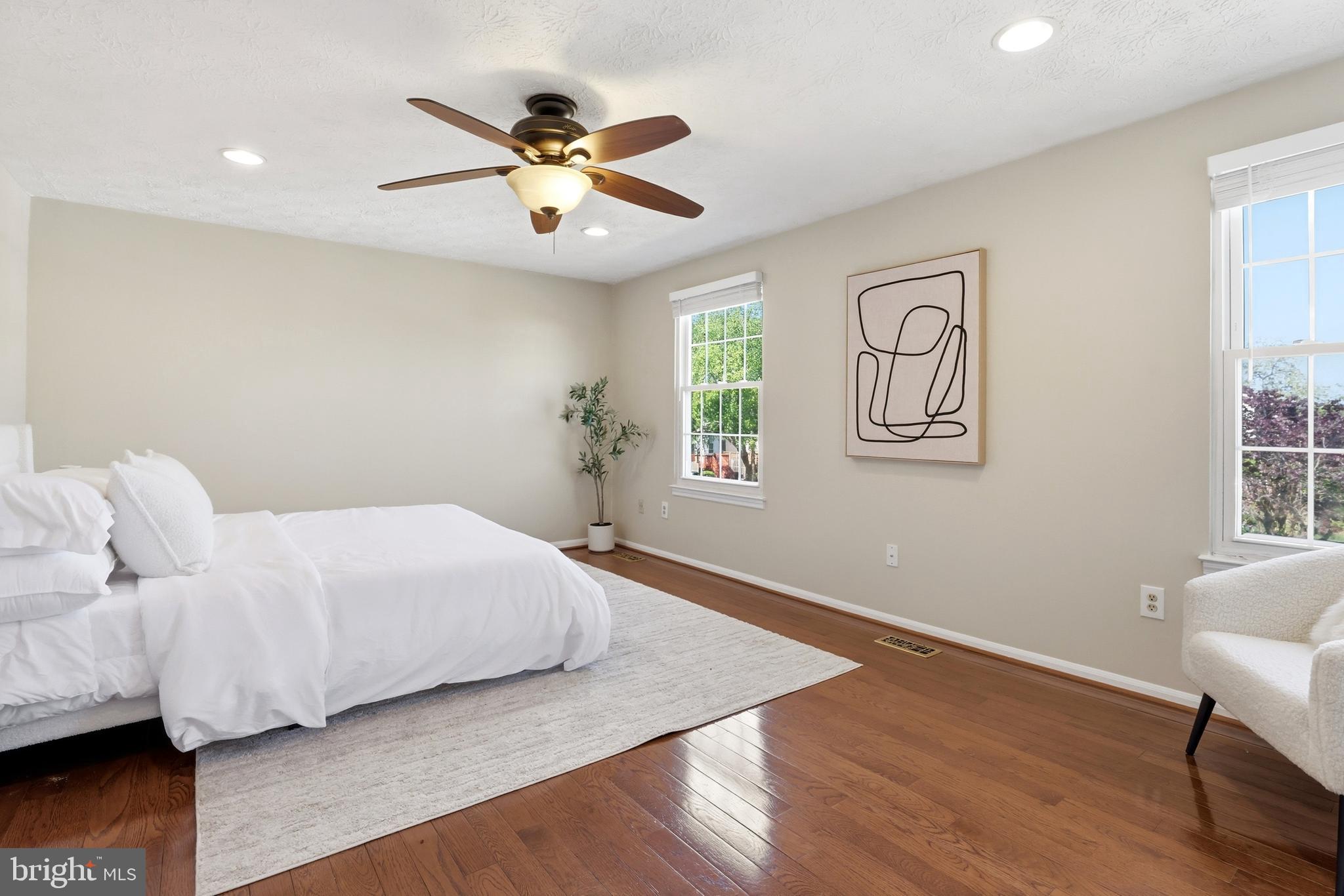 6167 Morning Glory Road Alexandria, VA 22310 - Photo 19 of 39 a bedroom with a bed and wooden floor