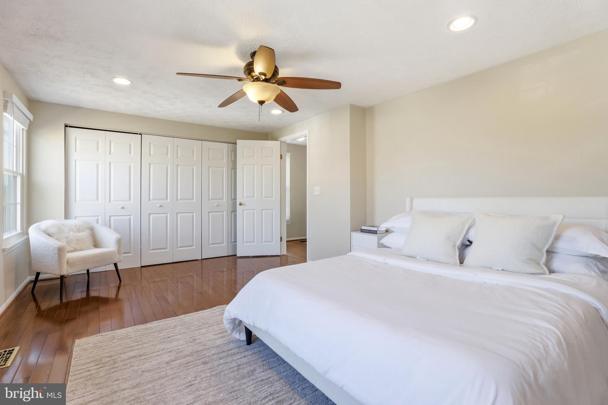 6167 Morning Glory Road Alexandria, VA 22310 - Photo 20 of 39 a spacious bedroom with a bed and a couch