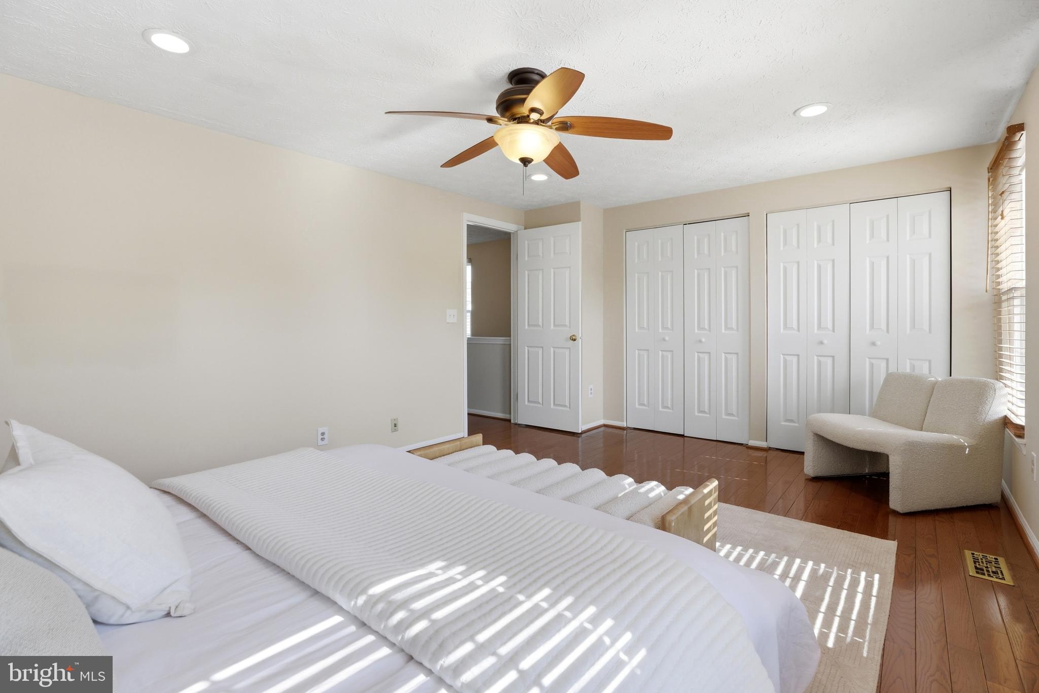 6167 Morning Glory Road Alexandria, VA 22310 - Photo 24 of 39 a bedroom with a large bed and a chandelier