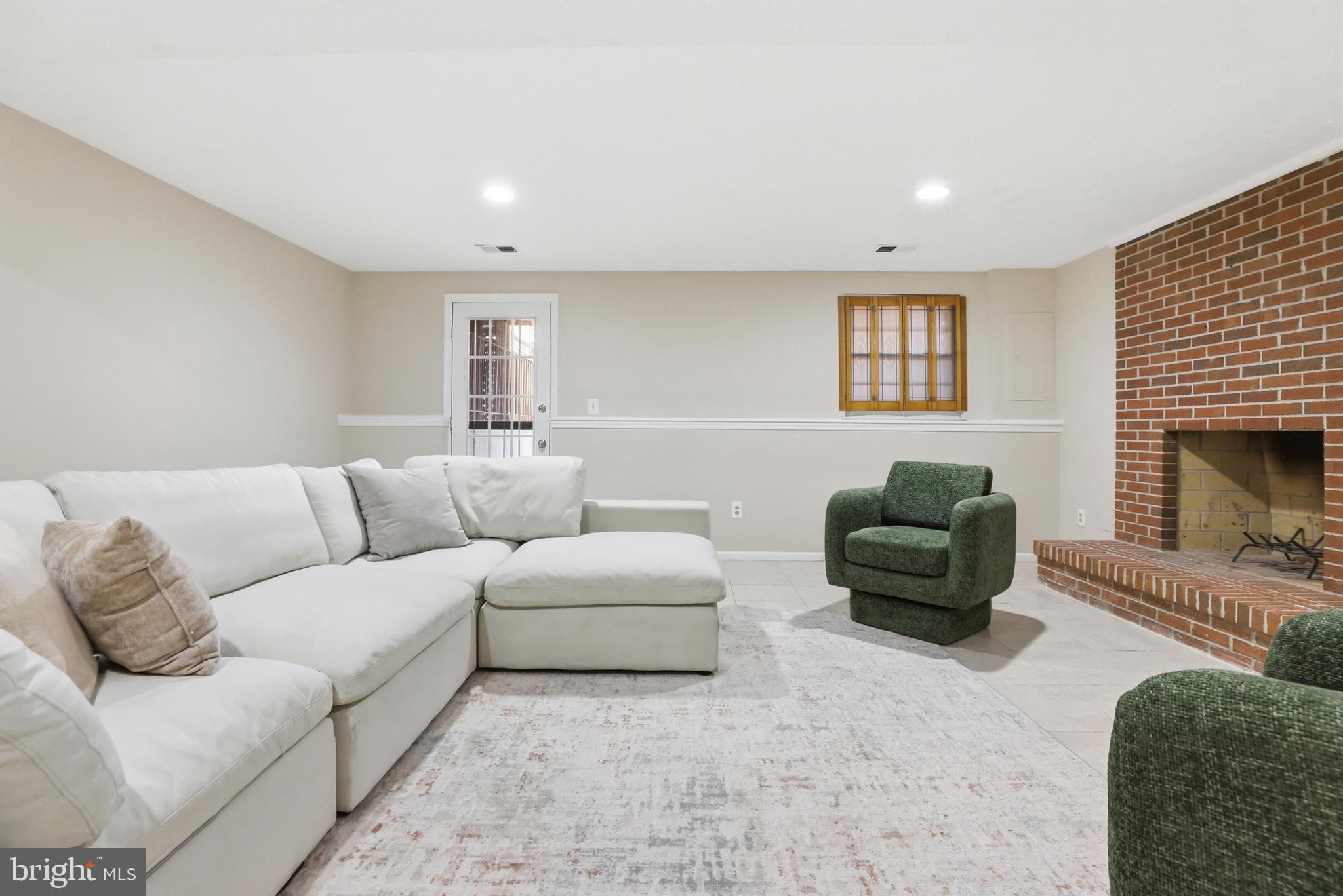 6167 Morning Glory Road Alexandria, VA 22310 - Photo 28 of 39 a living room with furniture window and a fireplace