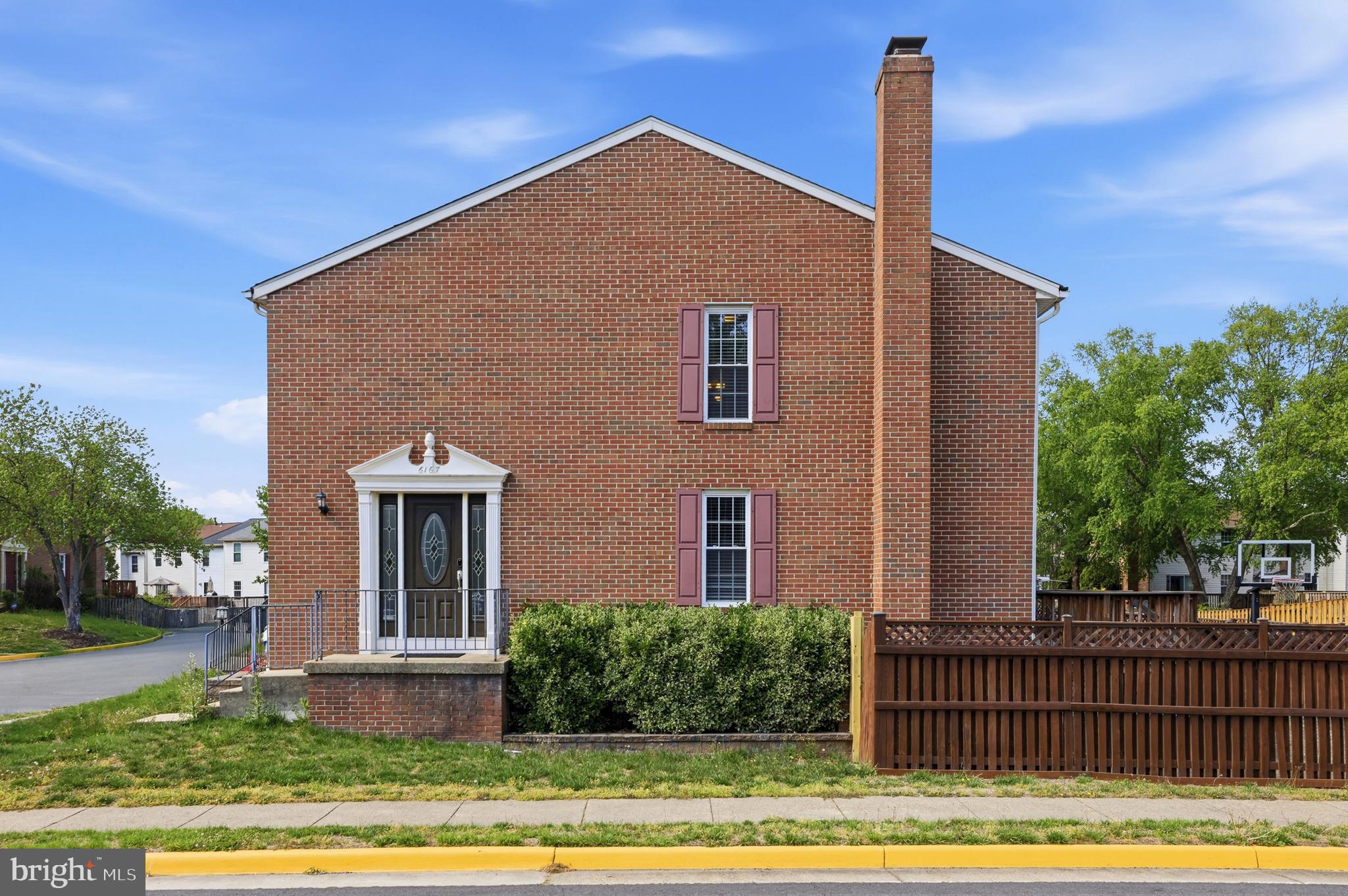 6167 Morning Glory Road Alexandria, VA 22310 - Photo 4 of 39 a front view of a house with a garden and plants