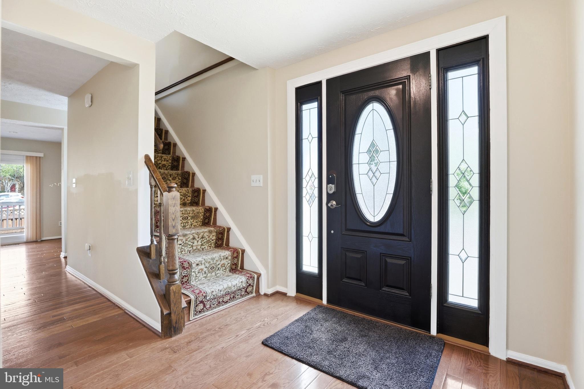 6167 Morning Glory Road Alexandria, VA 22310 - Photo 6 of 39 a view of a hallway with wooden floor and entryway