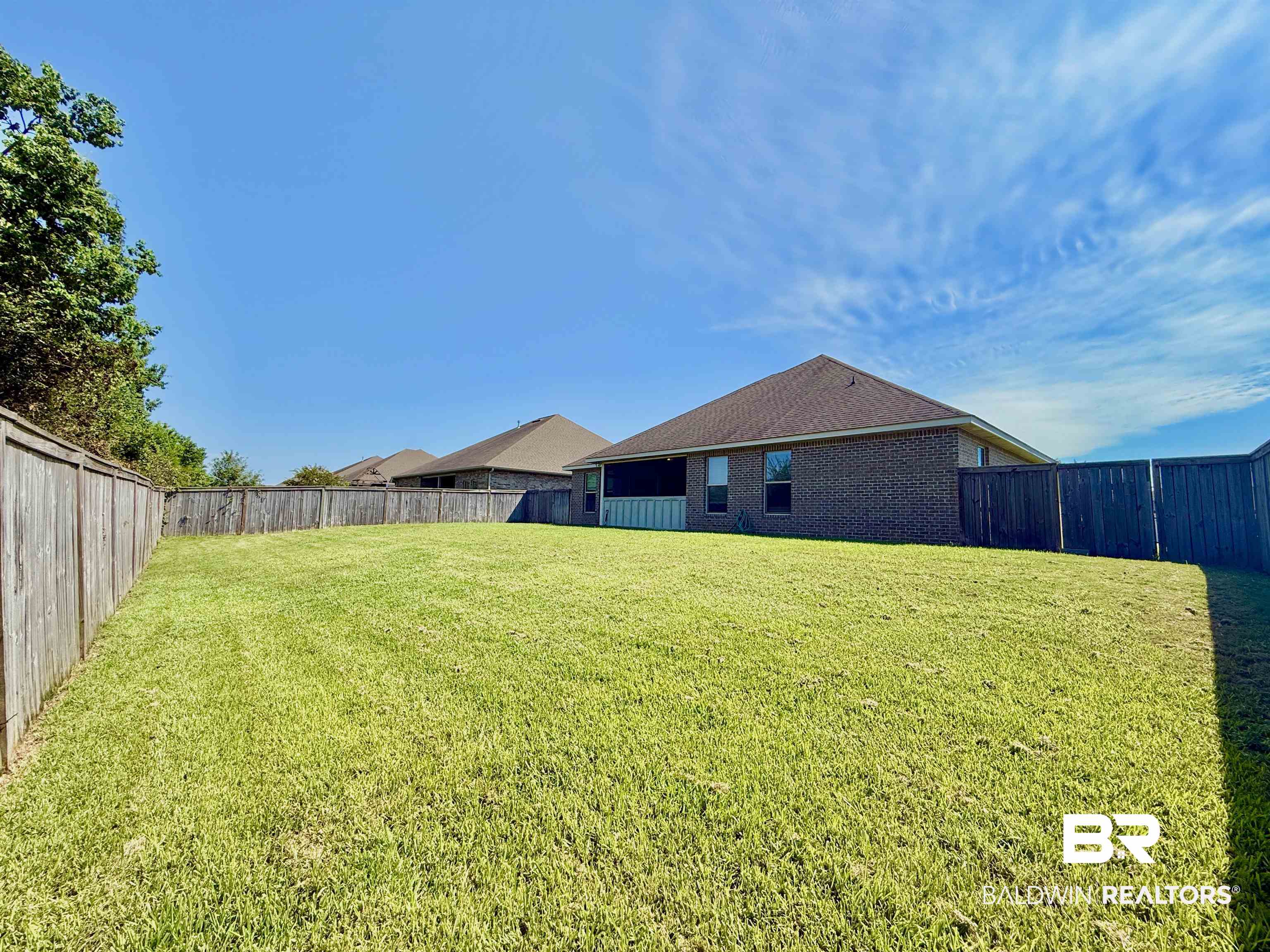 7011 Rocky Rd Loop Gulf Shores, AL 36542 - Photo 46 of 66 View of fenced backyard