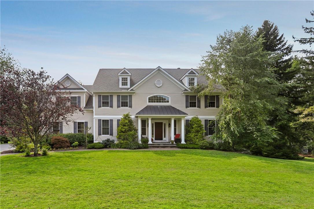 82 Old Farm Road Pleasantville, NY 10570 - Photo 1 of 1 a front view of a house with a garden