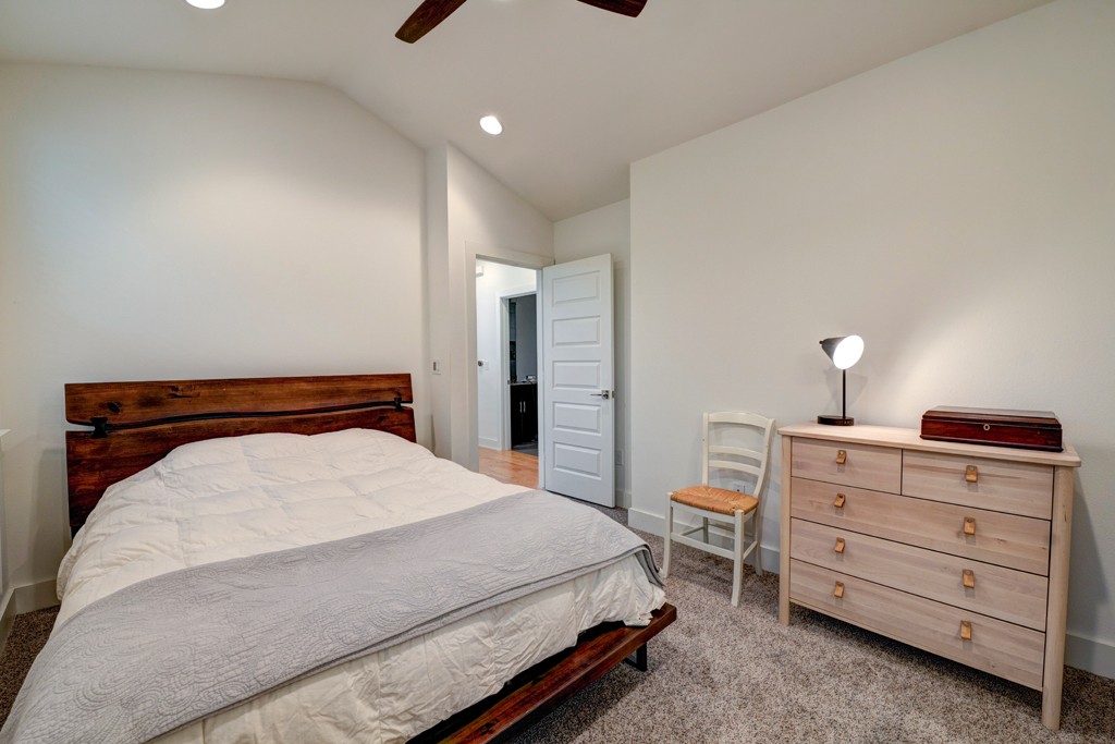 1300 Walnut Avenue, Unit B Austin, TX 78702 - Photo 14 of 15 a bedroom with a bed and a dresser