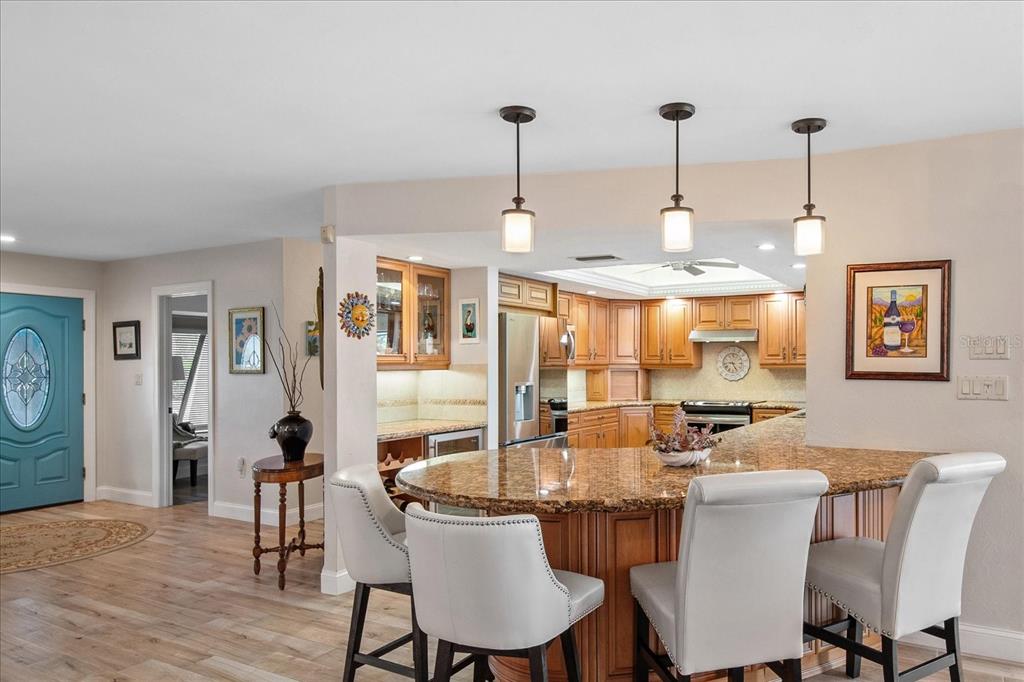184 Colony Point Drive Punta Gorda, FL 33950 - Photo 14 of 58 a view of a dining room with furniture window and wooden floor