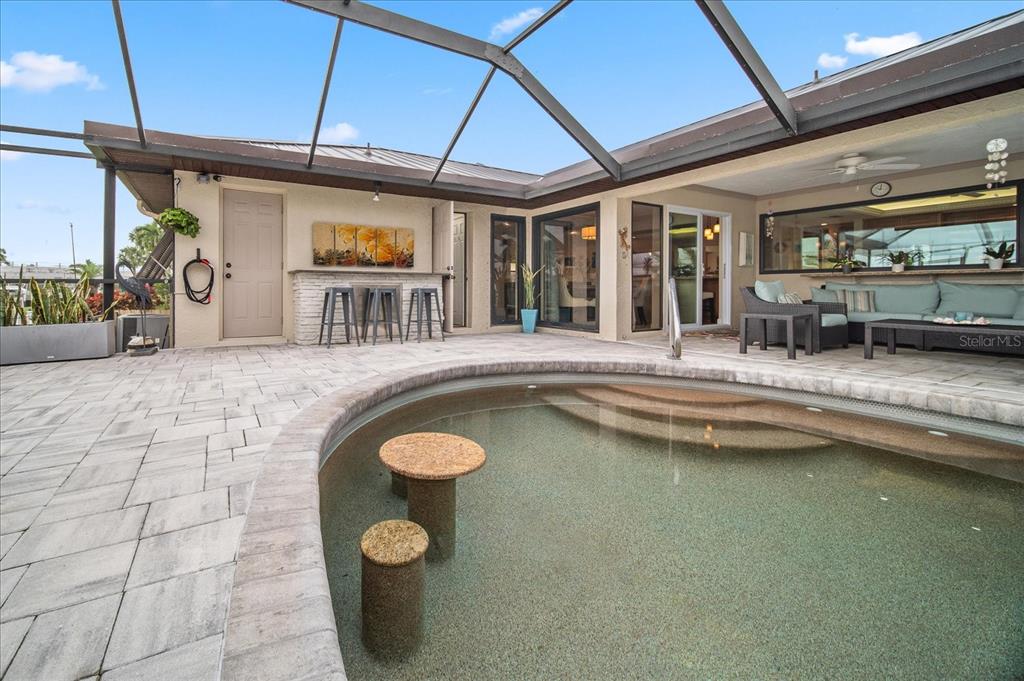 184 Colony Point Drive Punta Gorda, FL 33950 - Photo 23 of 58 a view of swimming pool with outdoor seating