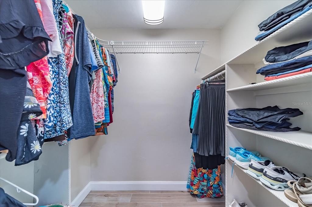 184 Colony Point Drive Punta Gorda, FL 33950 - Photo 32 of 58 a view of walk in closet with clothes and shoes