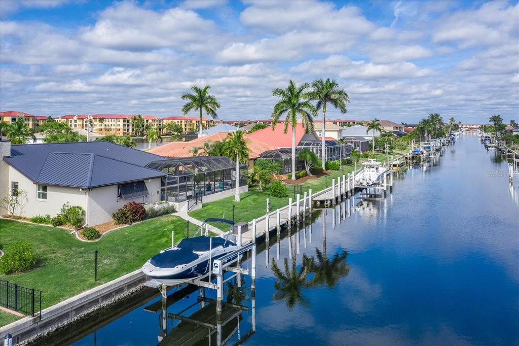 184 Colony Point Drive Punta Gorda, FL 33950 - Photo 54 of 58 a view of a house with a yard and potted plants