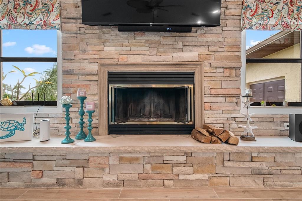 184 Colony Point Drive Punta Gorda, FL 33950 - Photo 7 of 58 a fireplace with stainless steel appliances