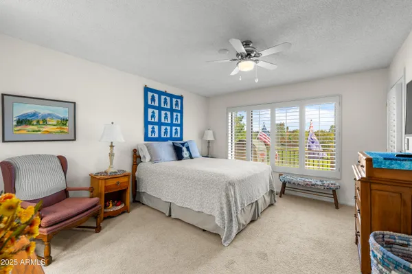 a living room with furniture a rug and a chandelier