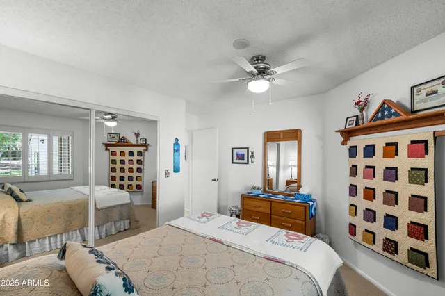 a spacious bathroom with a double vanity sink a large mirror and shower