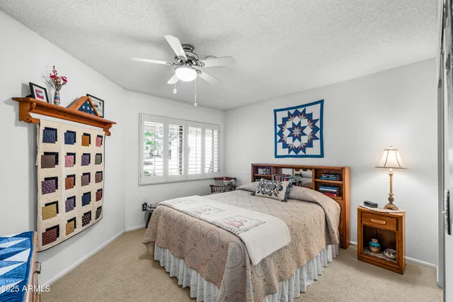 a bathroom with a shower a toilet and a shower