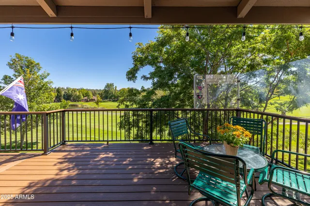 a living room with lots of furniture and refrigerator