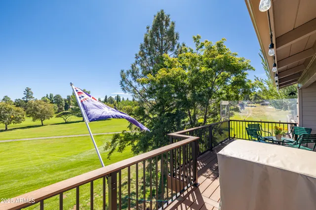 a view of a balcony with chairs