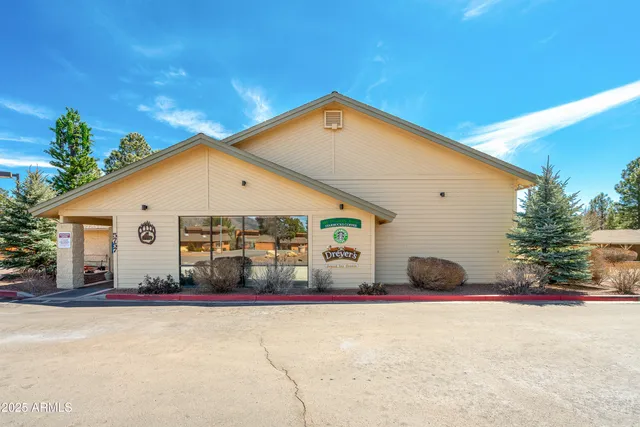 a view of a patio with chairs and tables
