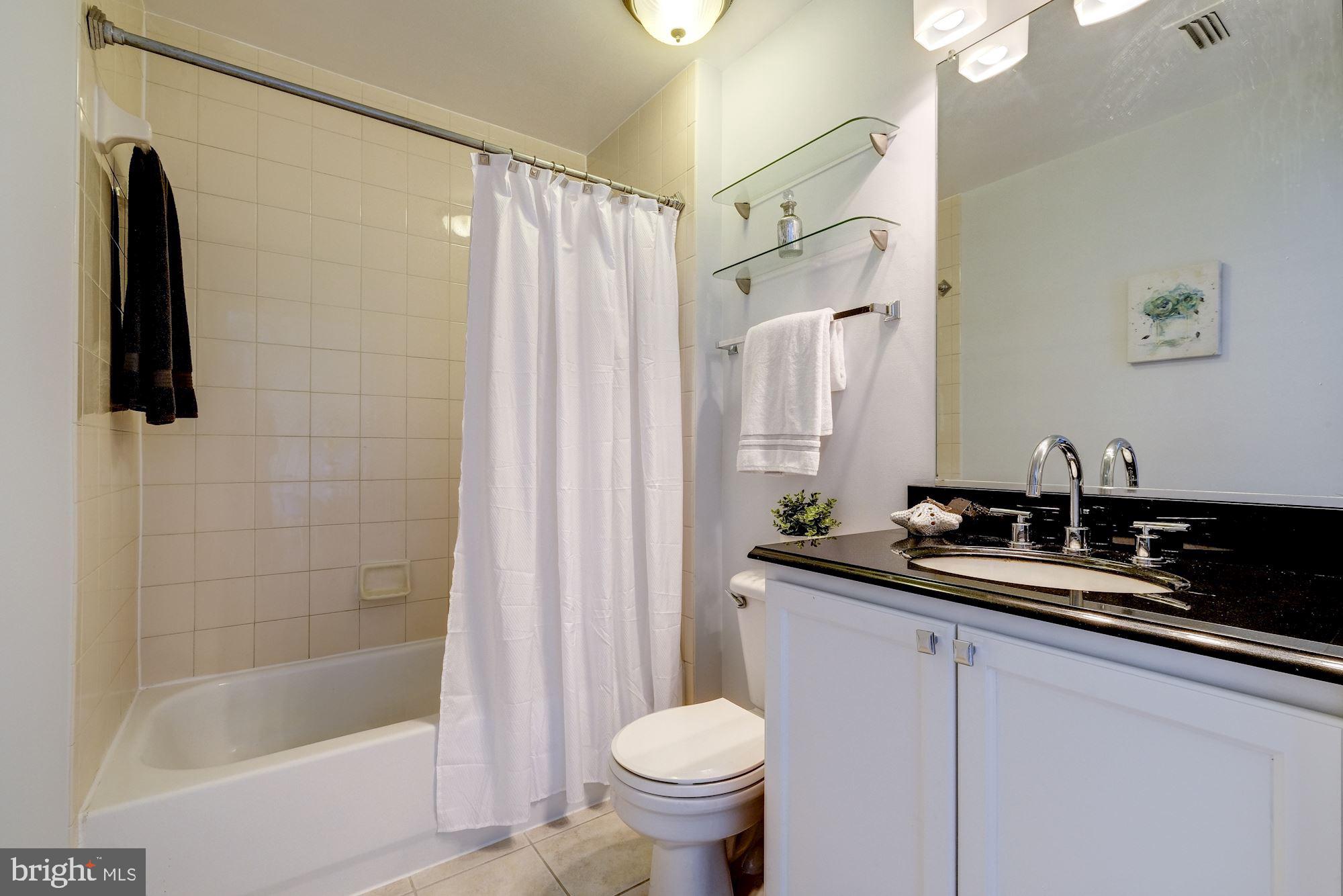 2004 11th Street Northwest, Unit 440 Washington, DC 20001 - Photo 8 of 18 Adjacent bathroom boasts a granite vanity