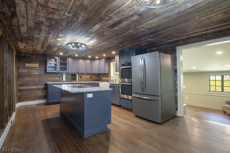 79 Lake Wallkill Road Vernon, NJ 07461 - Photo 3 of 27 a kitchen with stainless steel appliances granite countertop a refrigerator a sink and a stove