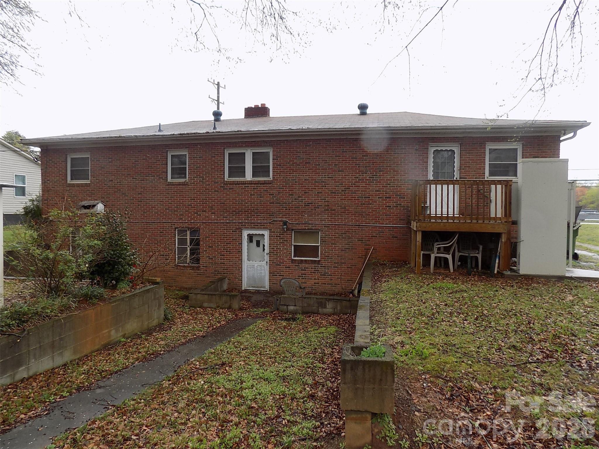 2605 Lowell Road Gastonia, NC 28054 - Photo 2 of 21 a front view of a house with garden