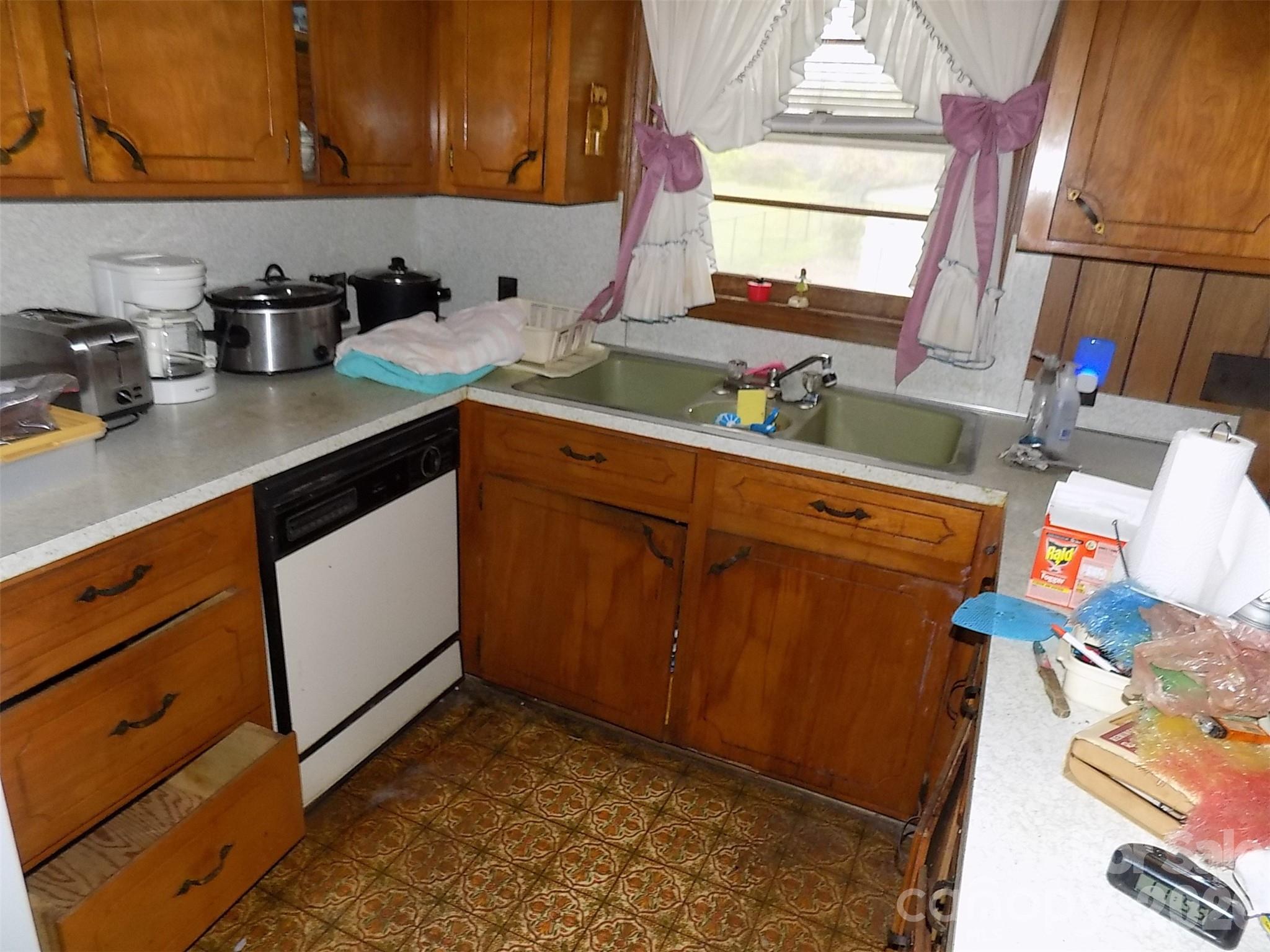 2605 Lowell Road Gastonia, NC 28054 - Photo 5 of 21 a kitchen with sink cabinets and window