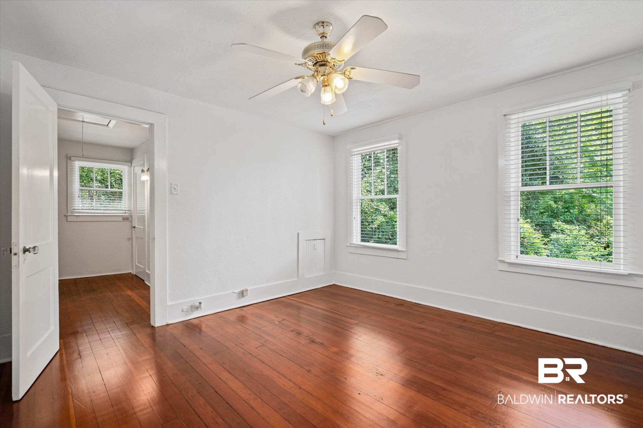 1159 Palmetto Street Mobile, AL 36604 - Photo 16 of 21 Unfurnished room with ceiling fan and dark wood-type flooring