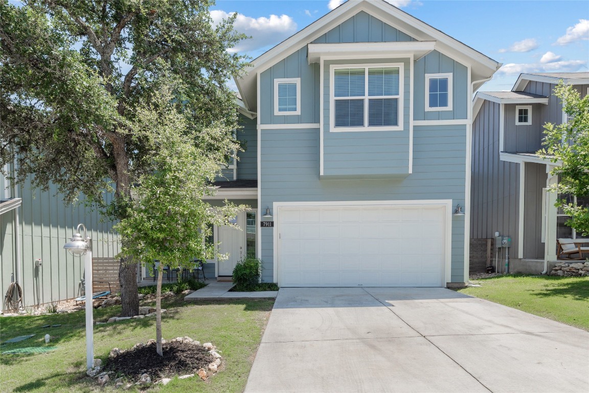 7911 Ryans Way Austin, TX 78726 - Photo 1 of 1 a front view of a house with a yard and garage