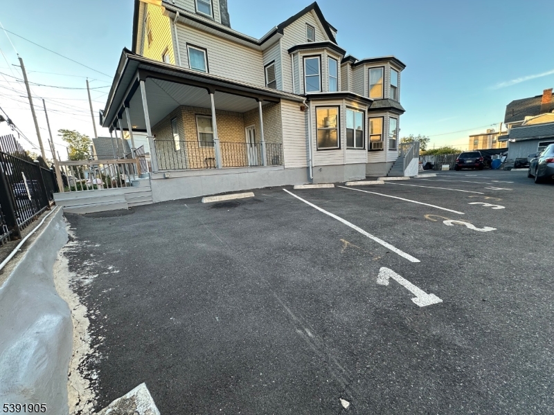 421 Ellison Street Paterson, NJ 07501 - Photo 2 of 12 a view of a car park in front of a house