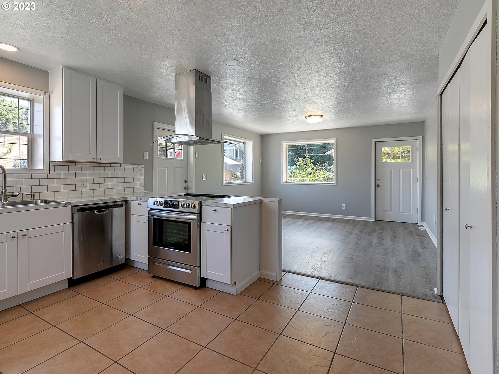 201 Southwest Hailey Avenue Pendleton, OR 97801 - Photo 8 of 35 a kitchen with a stove top oven sink and cabinets