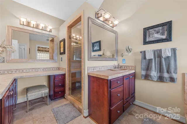 a bathroom with a sink double vanity and a mirror