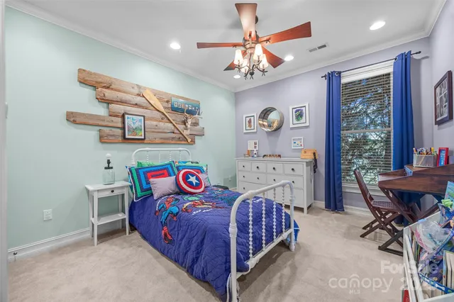 a bedroom with a bed dresser and furniture