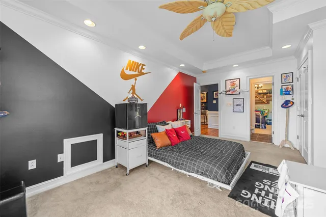 a living room with furniture and a dining table with wooden floor