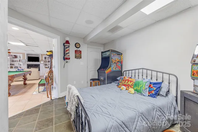 a view of a patio with table and chairs under an umbrella with wooden floor