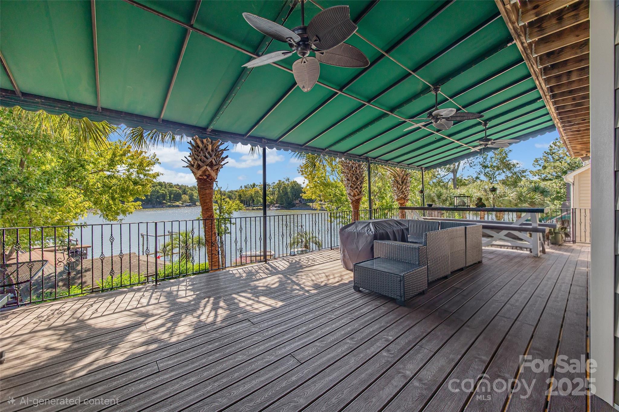 5650 Riverfront Road Clover, SC 29710 - Photo 22 of 48 a view of a patio with table and chairs under an umbrella with wooden floor