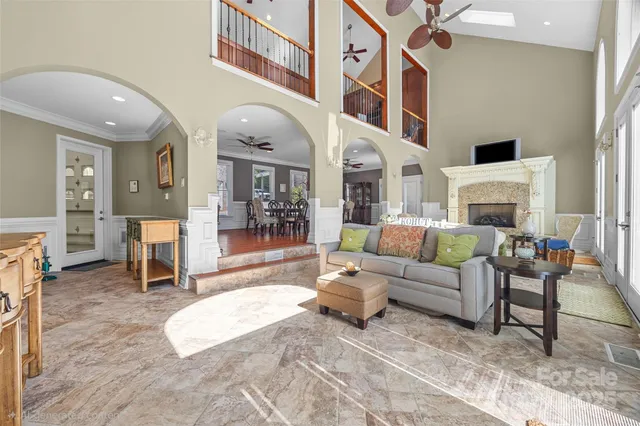 a living room with fireplace furniture and a window