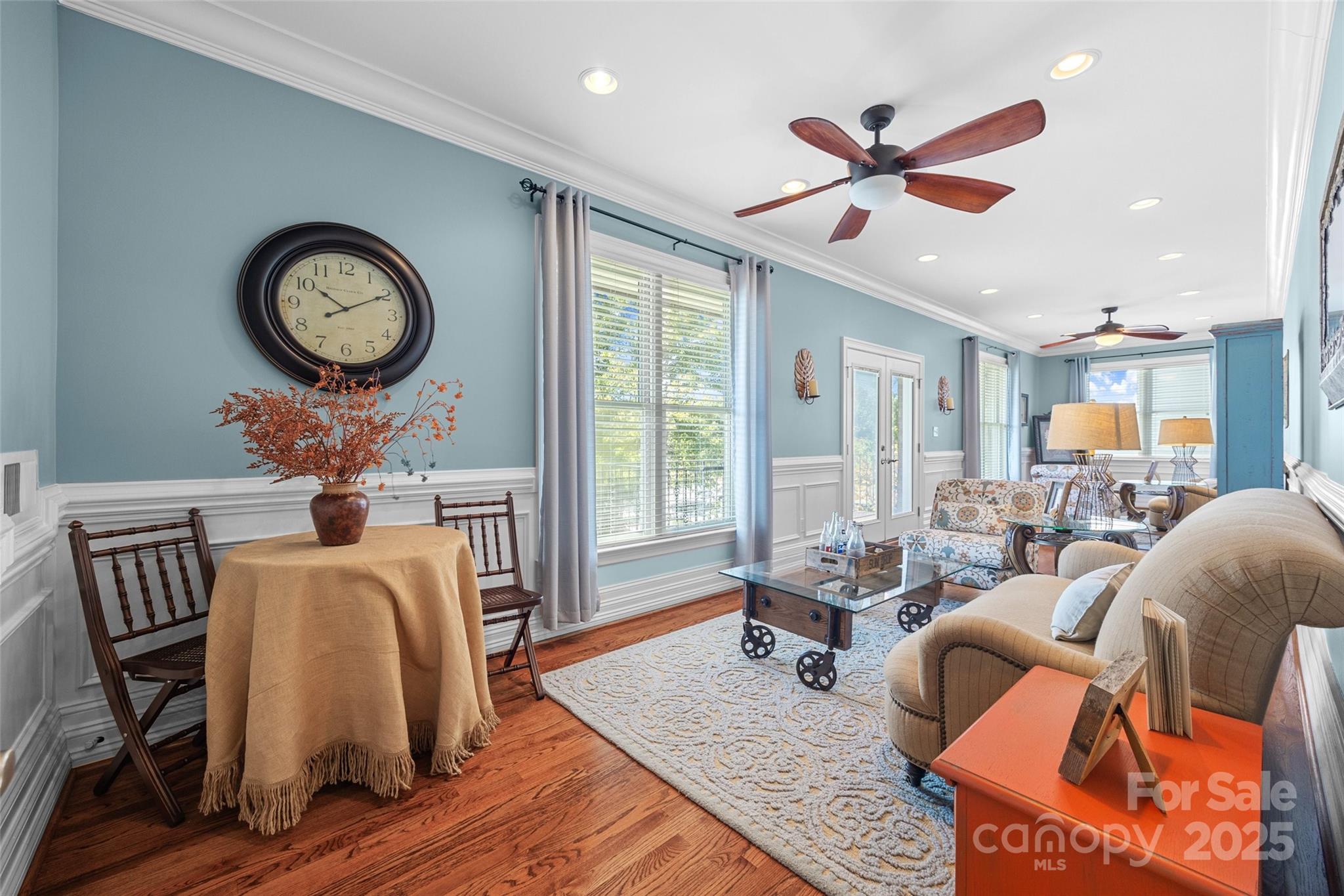 5650 Riverfront Road Clover, SC 29710 - Photo 29 of 48 a living room with furniture a clock potted plant and a large window