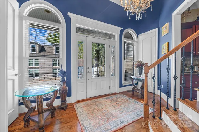 a view of a livingroom with furniture window and wooden floor