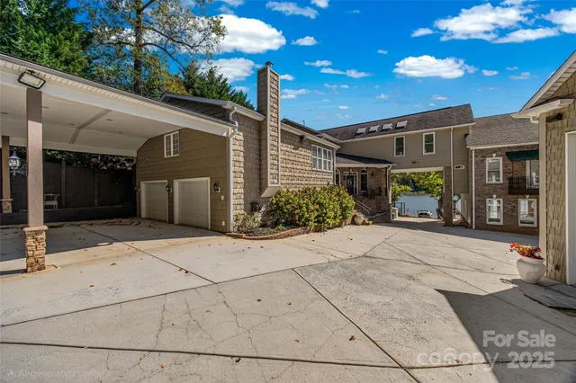 a view of a lake with two chairs