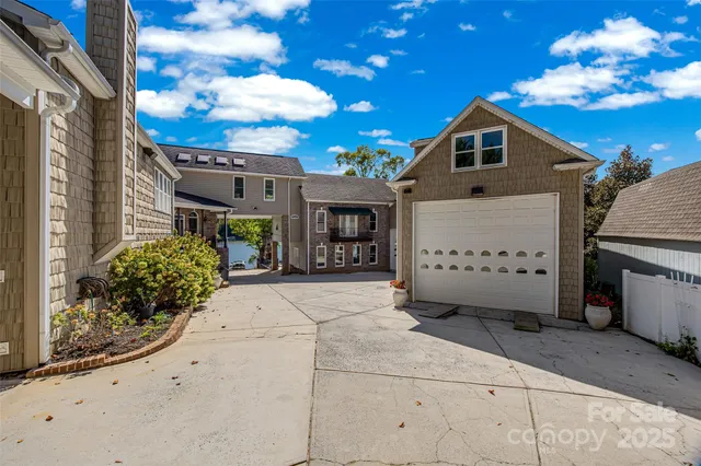 a view of a house with backyard porch and sitting area