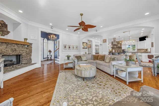 a living room with furniture a rug and a fireplace